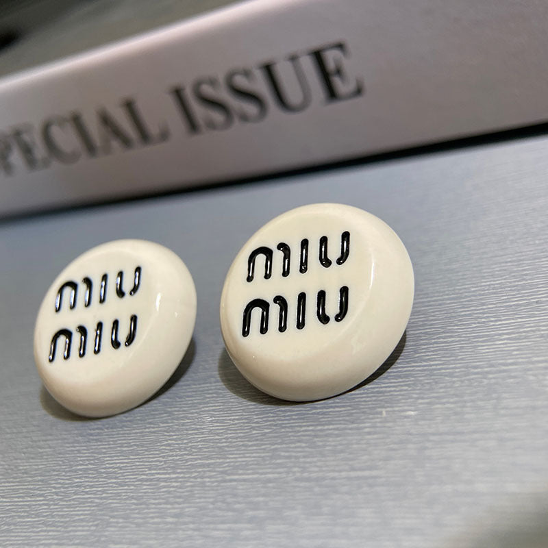 Black and white letter round earrings